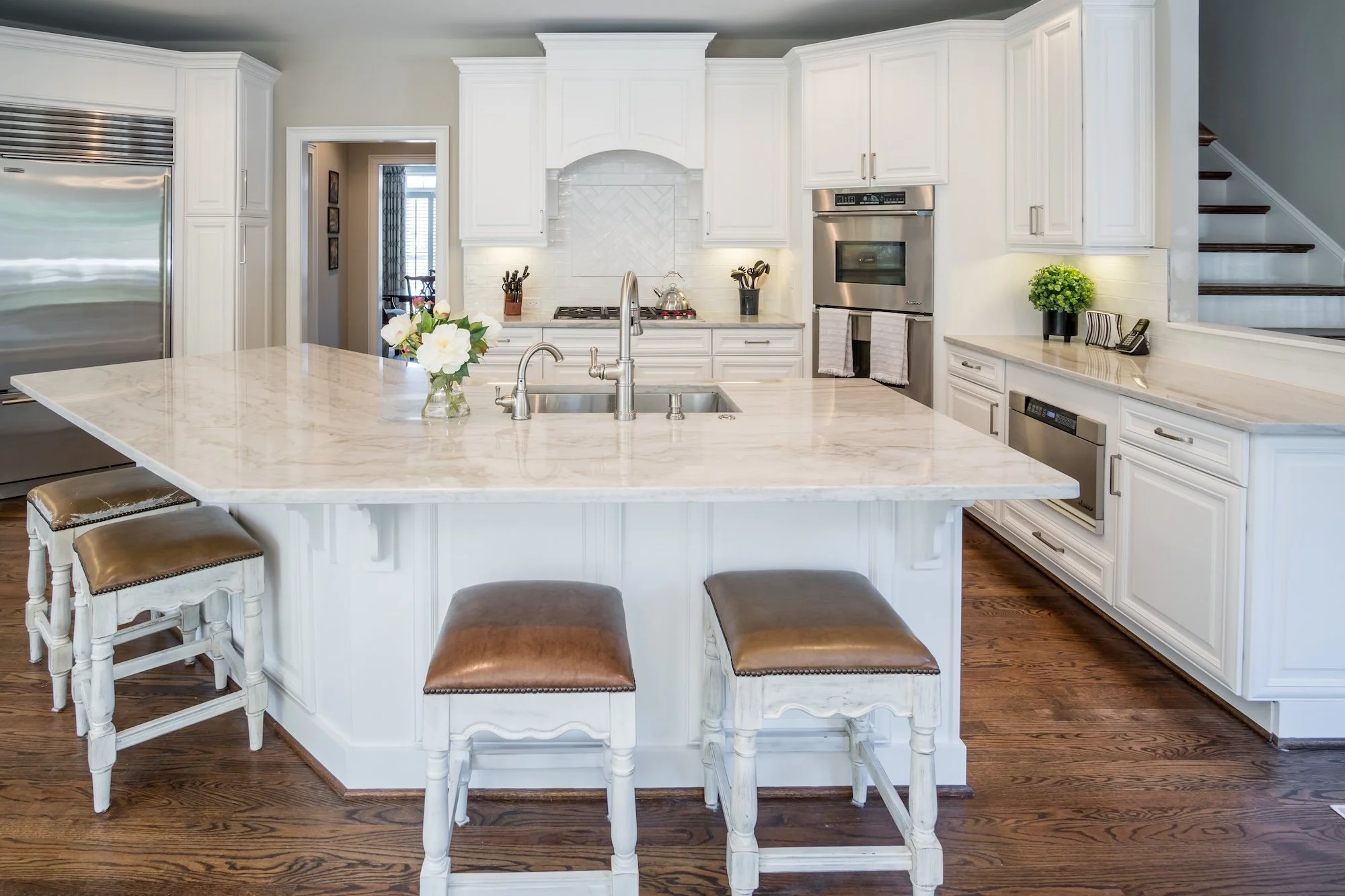 Modern looking kitchen after cabinet painting also known as cabinet refinishing.